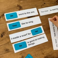 two children are playing with matching words on the same piece of paper