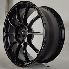 a black wheel is shown on a white background and it appears to be rims