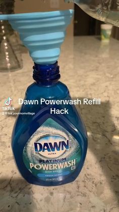 a bottle of dawn powerwash sitting on top of a counter