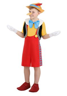 a young boy in a costume that is wearing red shoes and a yellow hat with blue trim