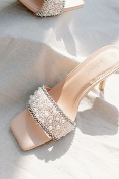 beaded pearl square-toe slip-in heels with a rhinestone detail absolutely perfect for our brides or if you plan to outshine the bride.....sorry, not sorry that heel is 3" tall and the insole has a nice padding for your comfort runs true to size Pearl Footwear, Low Heel Pearl Embellished Party Heels, Elegant Pearl Embellished Ankle Strap Heels, Formal Open-toe Pearl Heels, Elegant Pearl-embellished Open Toe Wedding Shoes, Luxury Pearl-embellished Heels For Party, Sneaker Heels Wedges, Boutique Trends, Heels & Wedges