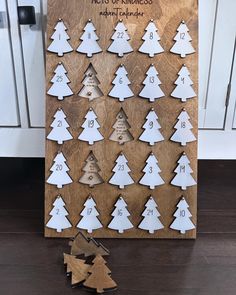 a wooden christmas tree with numbers on it