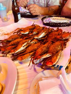 there are many crabs on the table ready to be eaten at this restaurant or take out