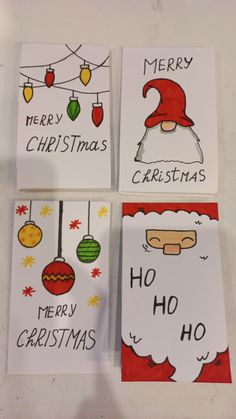 four christmas cards with santa's hats and ornaments on them