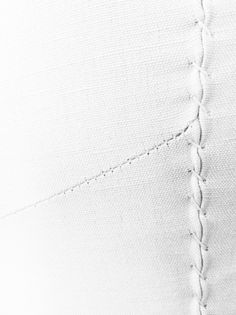 the stitching on the side of a white shirt