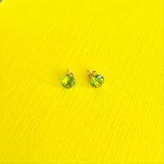 Light up the room with beautiful peridot. Symbolizing confidence and leadership, these olive-green, 14k solid gold earrings are a gorgeous complement to your inner beauty. DETAILS:Diameter: 6mmMaterial: 14k yellow goldStones: Peridot Cubic ZirconiaClosure: Push Back Classic Green Peridot Earrings, Green Peridot Earrings For Anniversary, Green 14k Gold Birthstone Earrings, 14k Gold Green Birthstone Earrings, Minimalist Green Earrings For Anniversary, Green Minimalist Earrings For Anniversary, Green 14k Gold Hypoallergenic Earrings, Hypoallergenic 14k Gold Green Earrings, Be Adventurous