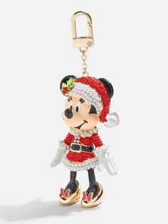 a mickey mouse keychain with a santa clause outfit on it's head