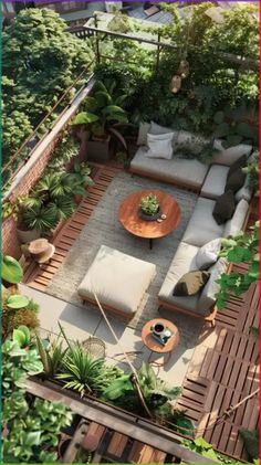 an aerial view of a patio with couches, tables and potted plants on it