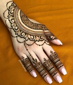 a henna tattoo is shown on someone's hand