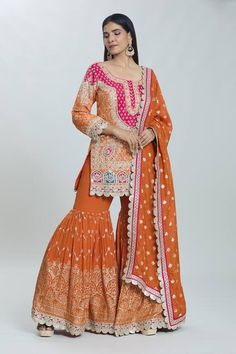 Orange padded kurta with sequin pearl embellished, floral zardozi embroidered patterns . Comes with can can attached sharara and dupatta. - Aza Fashions Festive Georgette Sharara With Gota Work, Chinon Sharara With Gota Work For Navratri, Chinon Sharara With Gota Work, Chinon Sharara With Mirror Work For Diwali, Fitted Sharara With Gota Work For Eid, Bollywood Georgette Sharara For Transitional Season, Diwali Sharara With Mirror Work In Chinon, Navratri Semi-stitched Sharara With Dabka Work, Transitional Season Bollywood Style Georgette Sharara