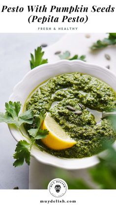 pesto with pumpkin seeds and pepita pesto in a white bowl on a table