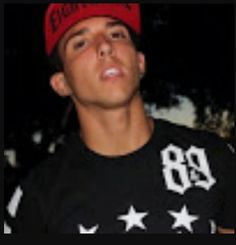 a young man wearing a red hat and black t - shirt with stars on it