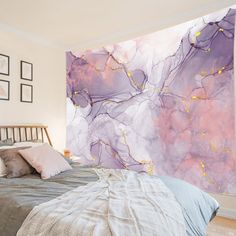 a bed room with a neatly made bed and a large painting on the wall behind it