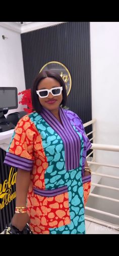 Made with 100% Cotton Ankara.  A perfect shift Dress with Asooke at the neck area and sleeve. Both pockets are at the front. Fitted Multicolor Kaftan With Kimono Sleeves, Fitted Multicolor V-neck Kaftan, Fitted Multicolor Dress With Kimono Sleeves, Multicolor Fitted Dress With Kimono Sleeves, Fitted Multicolor Short Sleeve Kaftan, Purple Short-sleeved Dress With Patchwork, Purple Patchwork Dress With Short Sleeves, Purple Short Sleeve Dress With Patchwork, Fitted Multicolor Tunic Kaftan