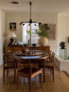 the dining room table is surrounded by chairs