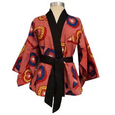 This Kimono-style design from Queen Adeline is handmade from luxuriously soft cotton, in a beautiful African print. From its kimono silhouette to its vibrant colors, this jacket is sure to make a statement. Preserving our environment while empowering women and preserving local artisan communities is at the heart of what we do. We intend to keep it that way! --- Made in the USA of 100% Cotton Machine wash cold, Tumble dry low, Warm iron if needed. Size/Inches BUST WAIST HIP S 35 27 36 M 37 30 39 Block Printed Textiles, Red Love, Our Environment, Print Kimonos, Kimono Style, Empowering Women, Fashion Seasons, Kimono Fashion, Waxed Cotton