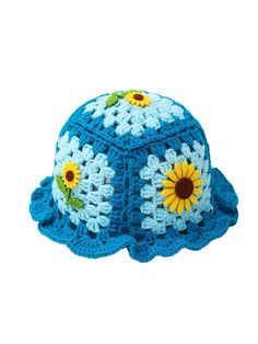 a blue crocheted hat with sunflowers on it