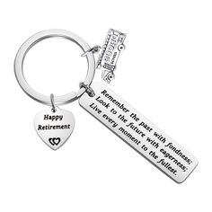 a keychain that says, happy retirement with a heart shaped tag on it