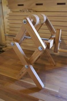 a pair of wooden chairs sitting on top of a hard wood floor