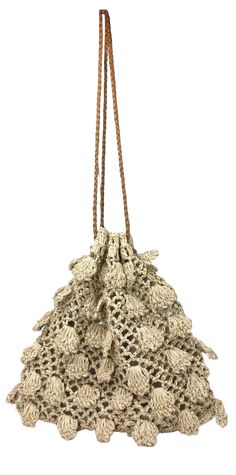 Indulge in luxury with our Cepha (Natural) bag. This unique raffia crochet bag features a delicate petal pattern, adding a touch of elegance to your ensemble. Its drawstring design allows for easy access to your essentials while its natural color complements any outfit. The perfect accessory for any sophisticated and exclusive look. 80% raffia / 10% leather / 10% polyester Dimensions L/W/H: 8.5 x 2 x 8.5 inches Made in the Philippines. Elegant Vacation Crochet Bag With Open Weave, Elegant Open Weave Crochet Bag For Vacation, Elegant Crochet Bag For Spring, Elegant Crochet Bag With Open Weave For Beach, Elegant Jute Crochet Bag, Elegant Woven Crochet Bag In Natural Color, Elegant Woven Jute Crochet Bag, Elegant Open Weave Crochet Travel Bag, Elegant Travel Crochet Bag With Open Weave