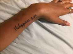 a person's arm with the word philippines on it and an inscription in black ink