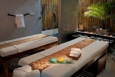 there is a spa room with two massage beds