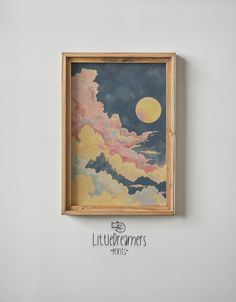 a painting hanging on the wall with clouds and a full moon in the sky above it