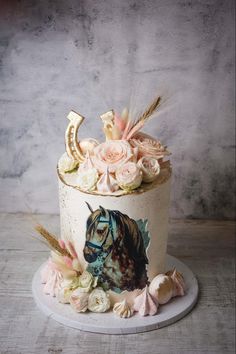 a cake with flowers and a horse on it