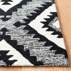 a black and white rug on the floor