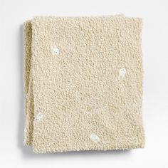 a white blanket with holes in it