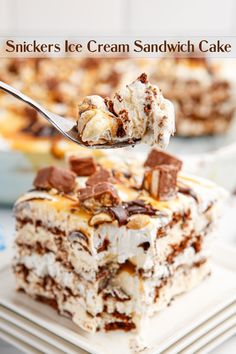 a piece of ice cream sandwich cake on a white plate with a fork in it