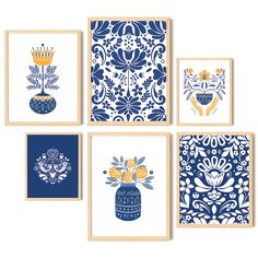 four blue and white wall art pieces with flowers in vases on the top one