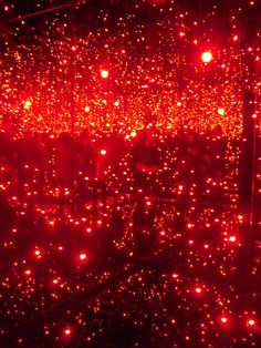 red lights shine brightly on the surface of a room with no one in it,