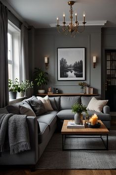 a living room filled with furniture and a chandelier hanging from the ceiling next to a window