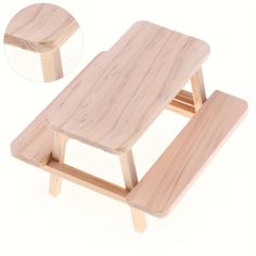 a small wooden table with two legs and a piece of wood sitting on top of it