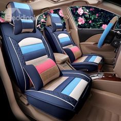 the interior of a car with blue and pink seats