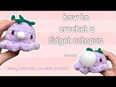 the crochet octopus is being held up to show how it's made