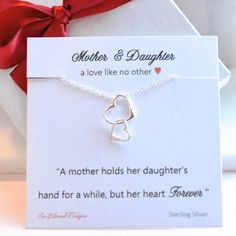 Mothers Necklace, To Mom from Daughter, Mother Daughter necklace, Connected Hearts Necklace, Double heart necklace  Such a meaningful necklace just for Mom! Show her this Mother's Day how much you care with this sterling silver connecting hearts necklace. Such a beautiful necklace she can wear alone or layer with other pieces.  The necklace comes on the message card as shown. Arrives in a beautiful gift box all ready for giving!  To see our entire shop go here: http://www.SoBlessedDesigns.etsy.c Meaningful Adjustable Necklace For Mother's Day, Adjustable Meaningful Necklaces For Mother's Day, Meaningful Heart Charm Necklace For Mother's Day, Valentine's Day Double Heart Charm Necklace For Mom, Nickel-free Double Heart Necklace For Anniversary Gift, Mother's Day Double Heart Nickel Free Necklace, Meaningful Necklace For Mom For Valentine's Day, Open Heart Necklace For Mom For Valentine's Day, Mother's Day Nickel Free Double Heart Necklace