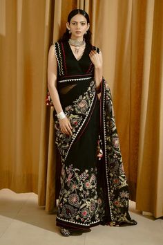 Black saree with aari thread embroidered floral motifs and scalloped border. Comes with padded scalloped border blouse. - Aza Fashions Elegant V-neck Choli With Resham Embroidery, Traditional V-neck Sharara For Party, V-neck Traditional Wear With Resham Embroidery For Party, Festive V-neck Georgette Blouse Piece, Elegant V-neck Traditional Wear With Pallu, Designer V-neck Choli With Resham Embroidery, Party V-neck Traditional Wear With Zari Work, Elegant Lehenga With Resham Embroidery And V-neck, V-neck Blouse Piece For Diwali Reception