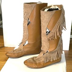 "Vintage 70s bohemian fringe suede leather knee-high mid calf flat moccasin boots made in Spain.  Tan camel with cut outs.  Good condition with a few minor marks.  Sold as is. Says 8.5 but fits more like 7-7.5 us Feet 9-95\" should work best. Final sale, consider this a virtual yard sale!" Bohemian Knee-high Leather Boots, Bohemian Suede Boots With Tassels, Bohemian Fall Boots With Flat Heel, Bohemian Leather Boots With Fringe, Brown Tasseled Boots For Festivals, Leather Fringe Boots For Fall, Casual Leather Fringe Boots, Spring Bohemian Boots With Fringe, Brown Fringe Boots For Festival