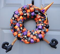 a halloween wreath decorated with candy and decorations