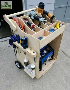 a wooden cart filled with lots of tools