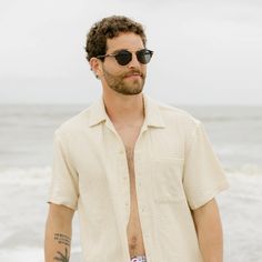 Designed for the guy weaving in and out of vacation, this natural sand-toned woven shirt blends in with the locals and stands out in the crowd. Our new breezy textured shirt comes equipped with a vintage camp collar, our signature Coconuttons™ and the stealth Sunglass Loop™ so you’re ready for whatever adventure you find yourself on this summer. Often spotted on the beach, occasionally seen on the scene, always known for hopping on the next flight. Bound to sell out quickly. Kenny Flowers, Textured Shirt, Smaller Hips, Vintage Camping, Beige Style, Terry Shorts, Double Trouble, Sell Out, Man Swimming