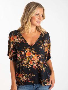 Cheap Versatile V-neck Top For Spring, Cheap V-neck Festive Blouse, Patterned Floral V-neck Top, Affordable Vibrant V-neck Tops, Versatile V-neck Tops With Floral Print, Cheap Vibrant Print V-neck Top, Black Printed V-neck Top, Versatile Floral Print V-neck Tops, Red Bouquets