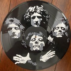 the rolling stones are depicted on an old vinyl record with their faces painted onto it