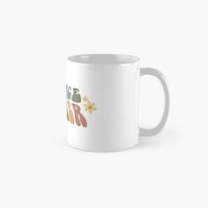 a white coffee mug with the words i love you in different colors and designs on it