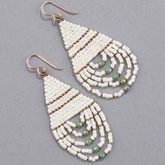 white beaded earrings with green beads