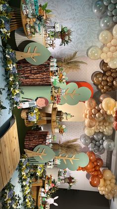 an overhead view of a table with balloons and decorations on the wall, along with other items