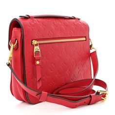 This is an authentic LOUIS VUITTON Empreinte Pochette Metis in Scarlet. This chic handbag is finely crafted of Louis Vuitton monogram-embossed leather in red. The shoulder bag features a red leather top handle, an optional, adjustable shoulder strap, a rear zipper pocket, and a front flap with a polished brass S-lock. The flap opens to a partitioned red and black striped fabric interior. Red Leather Top, Louis Vuitton Empreinte, Striped Fabric, Chic Handbags, Striped Fabrics, Polished Brass, Leather Top, Authentic Louis Vuitton, Red And Black