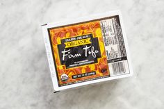 an open box of organic frozen fruit on a marble counter top with the label for fresh fruit